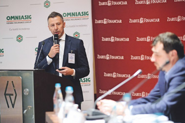 Omniasig CEO Mihai Tecau, talks at a conference (photo, © Omniasig)